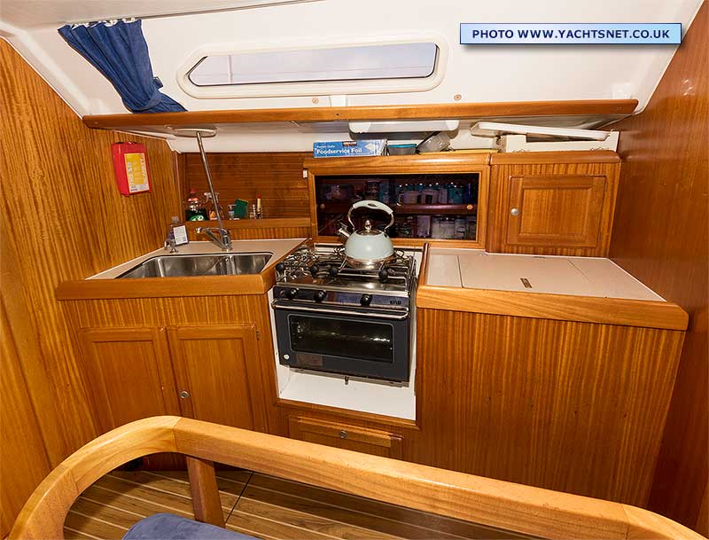 Galley with twin sinks, cooker and fridge